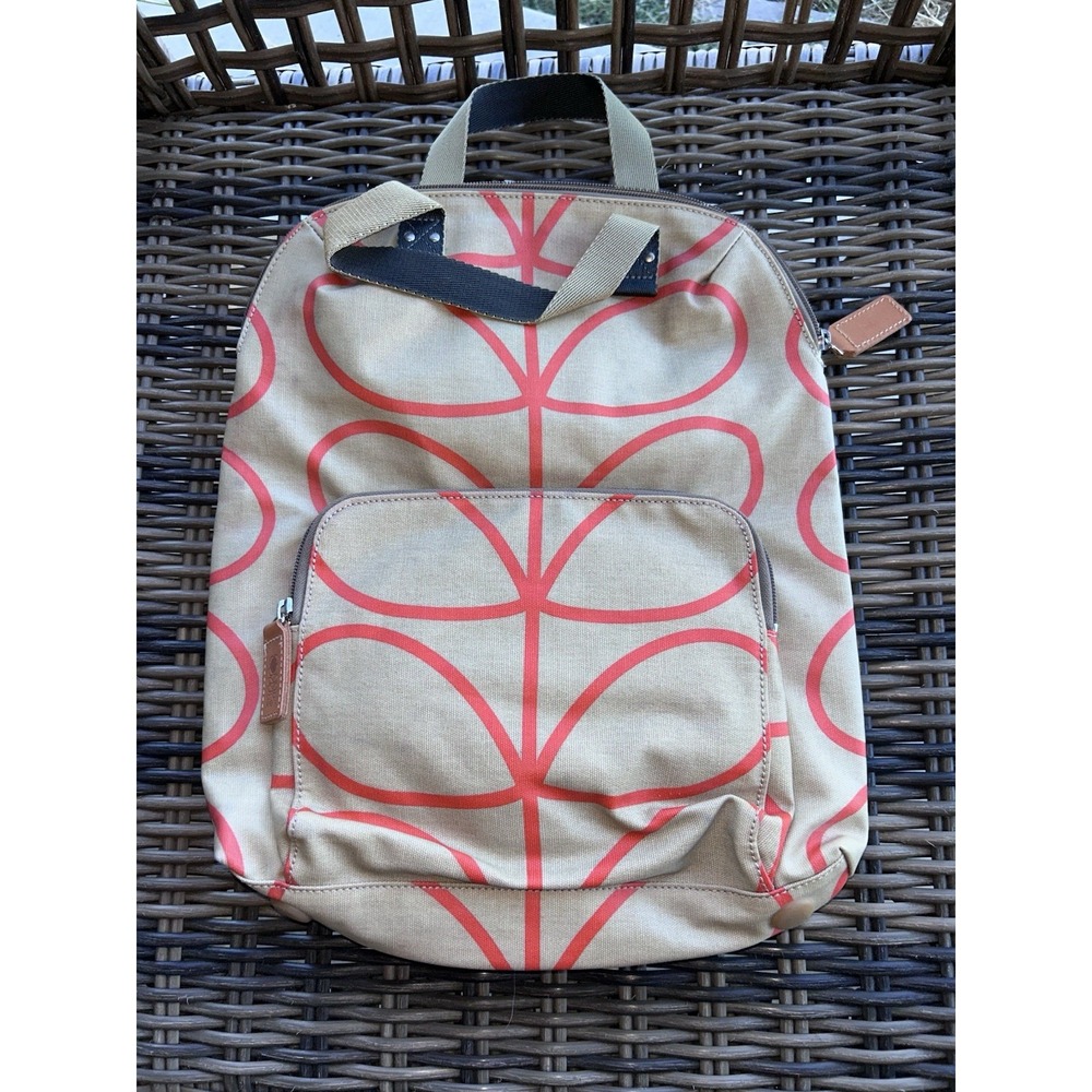 Orla Kiely Stem Print Backpack in a tan and orange Coated Canvas